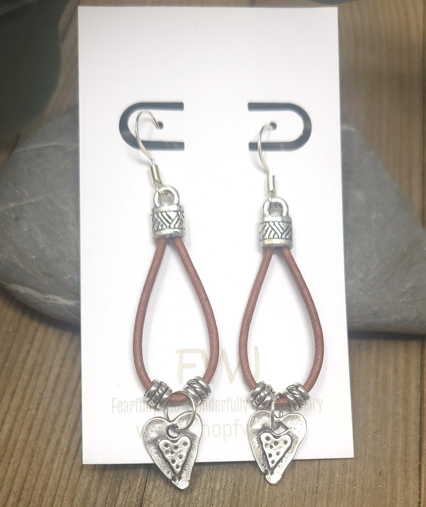 Leather drop earrings with a silver heart, leaf or cross charm